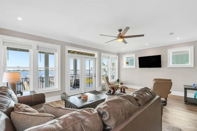 a view of a porch with furniture and a gate