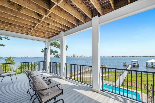 a bedroom with a bed and a flat screen tv in it