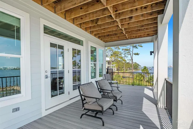 a en suite bathroom with a granite countertop sink and a mirror