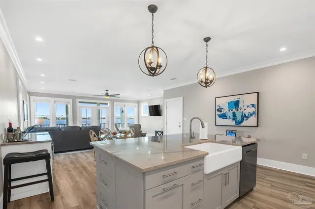 a kitchen with stainless steel appliances granite countertop a stove a microwave and a refrigerator