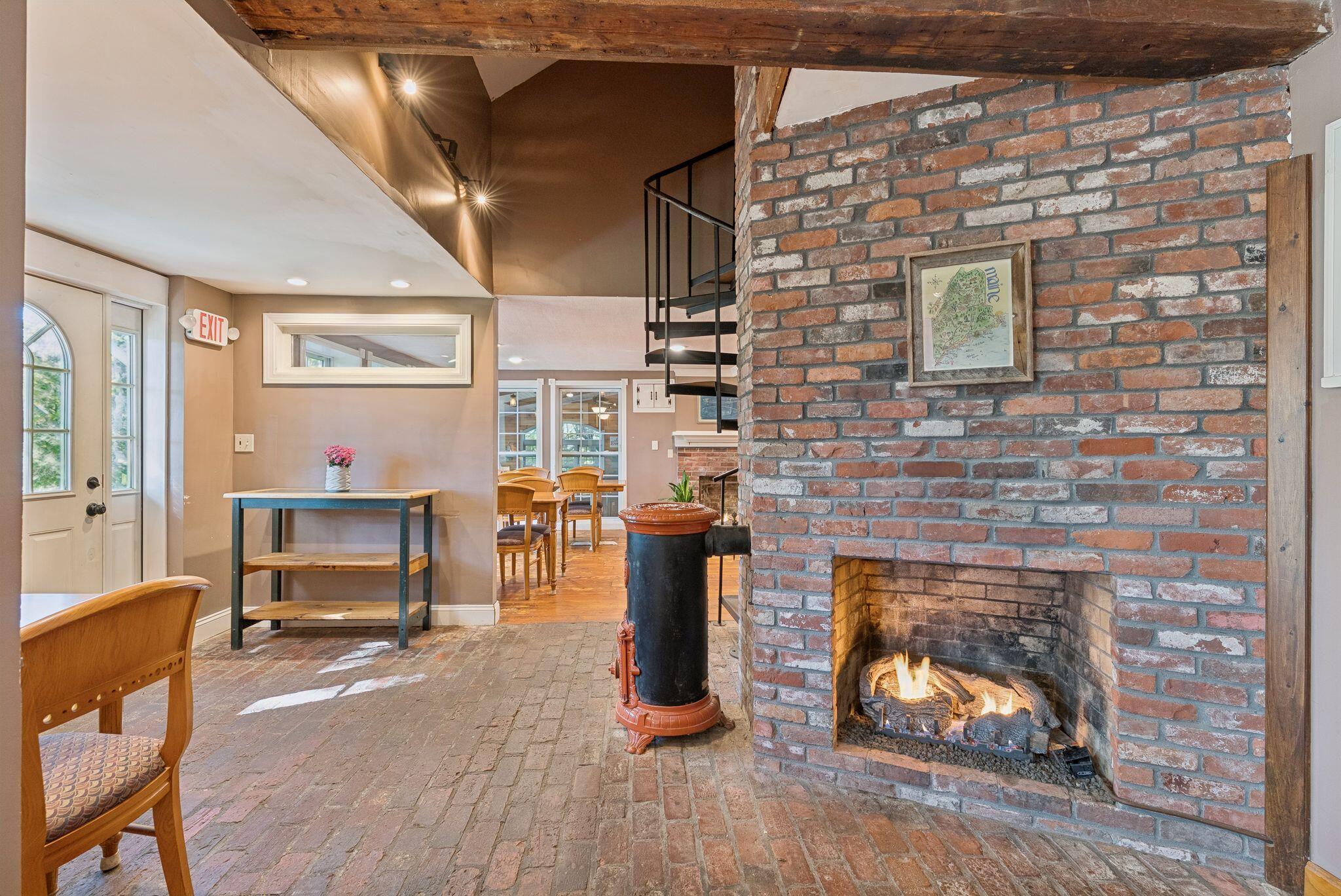 557 Coles Hill Road Wells, ME 04090 - Photo 17 of 35 Fireplace and Front Entrance