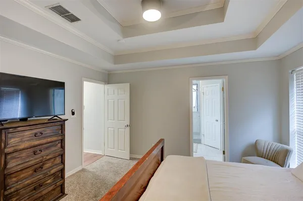 a bedroom with a bed and furniture