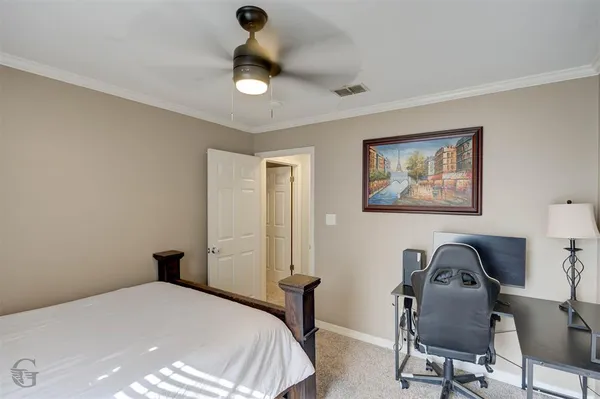 a bedroom with a bed and furniture