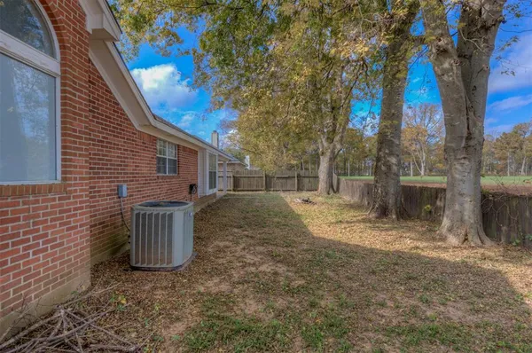 a backyard of a house with lots of green space