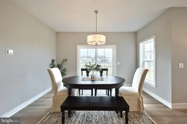 a view of an entryway with wooden floor