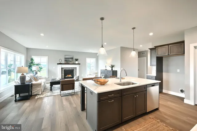 a kitchen with lots of counter top space and furniture