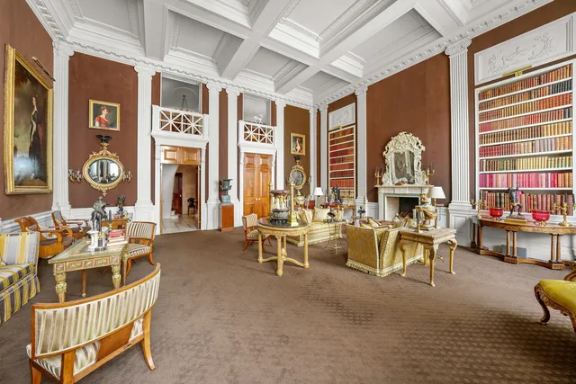 a room with lots of chairs and a chandelier