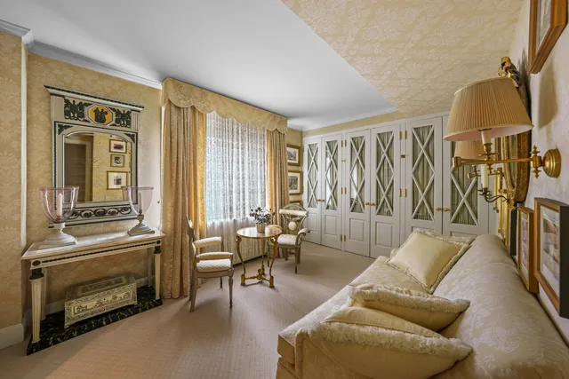 a view of hall way with furniture