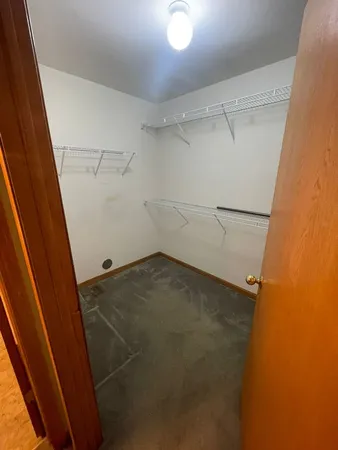 a spacious bathroom with a double vanity sink and a mirror