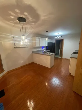 a kitchen with a sink stainless steel appliances and cabinets