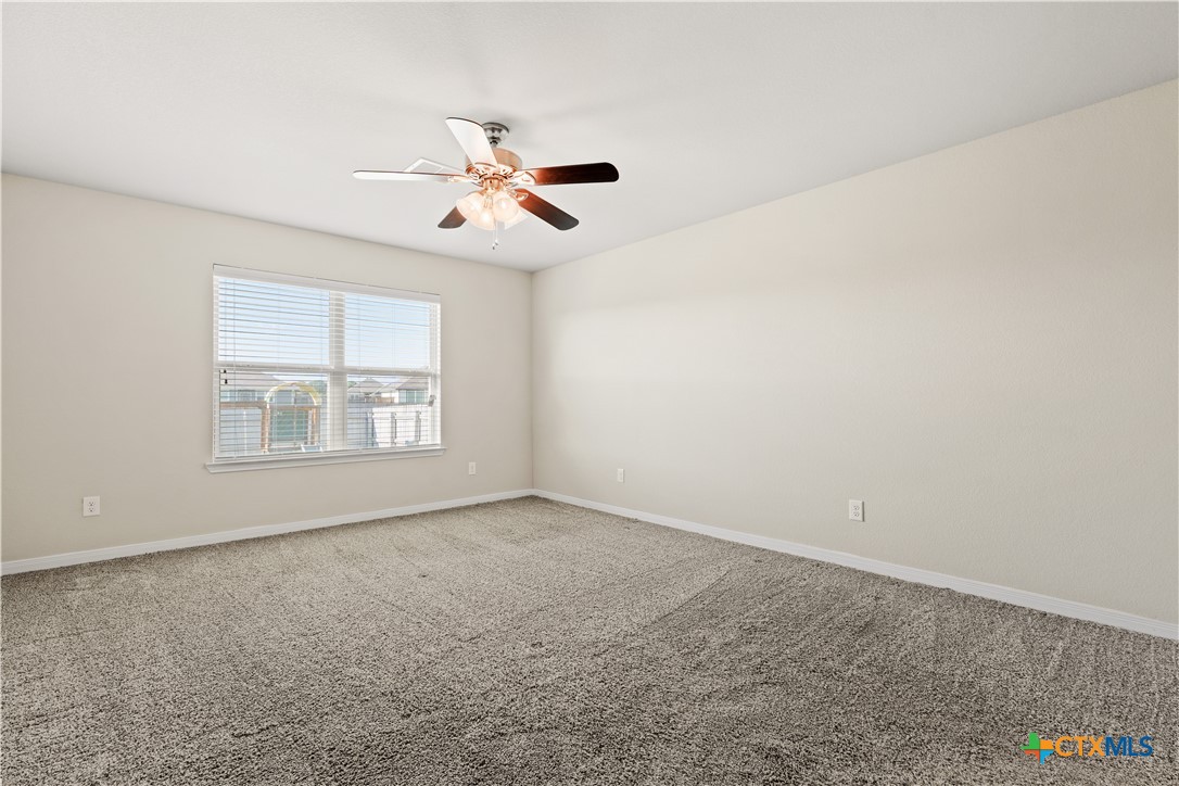 4124 Riata Ranch Road Waco, TX 76705 - Photo 13 of 26 a view of an empty room with a window