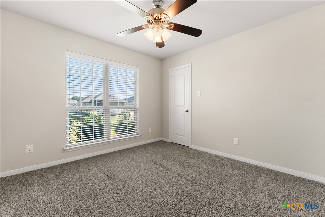 4124 Riata Ranch Road Waco, TX 76705 - Photo 18 of 26 a view of an empty room with a window