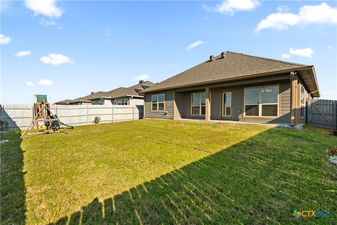4124 Riata Ranch Road Waco, TX 76705 - Photo 23 of 26 a front view of a house with a yard