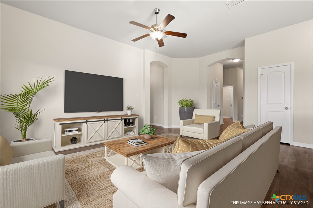 4124 Riata Ranch Road Waco, TX 76705 - Photo 8 of 26 a living room with furniture and a flat screen tv