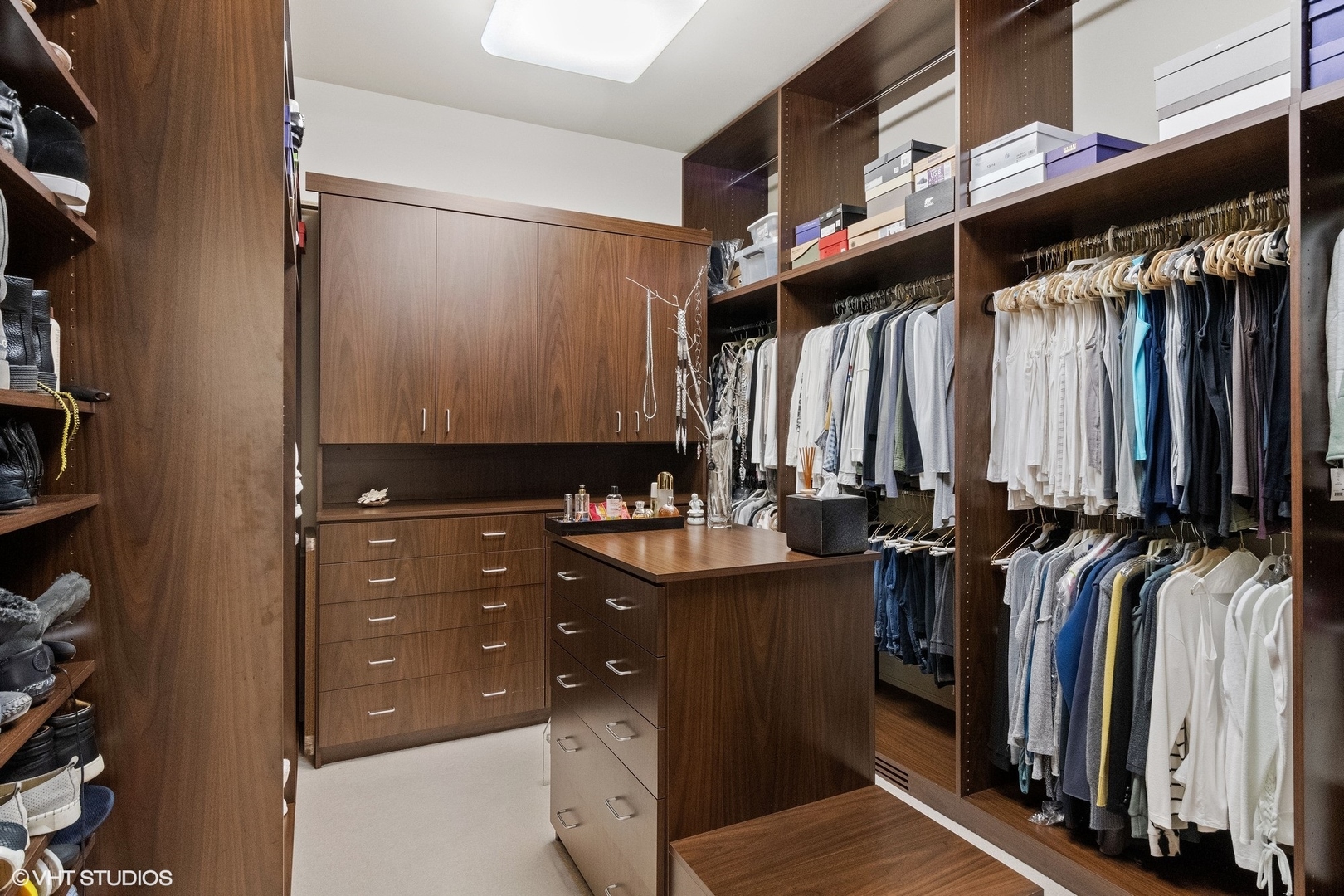 1632 Saunders Road Riverwoods, IL 60015 - Photo 23 of 38 a view of walk in closet with clothes and shoes