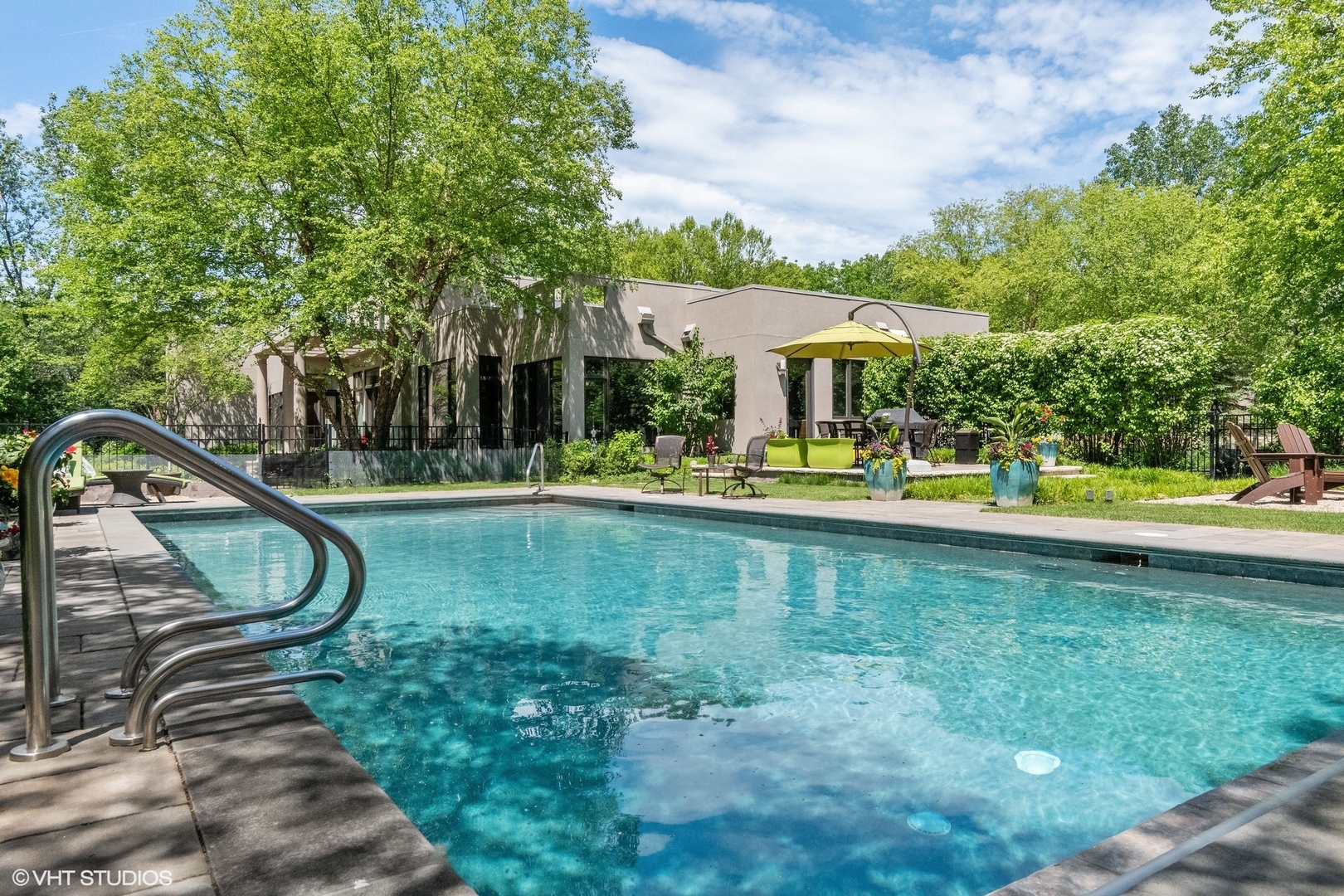 1632 Saunders Road Riverwoods, IL 60015 - Photo 3 of 38 a swimming pool with outdoor seating and yard