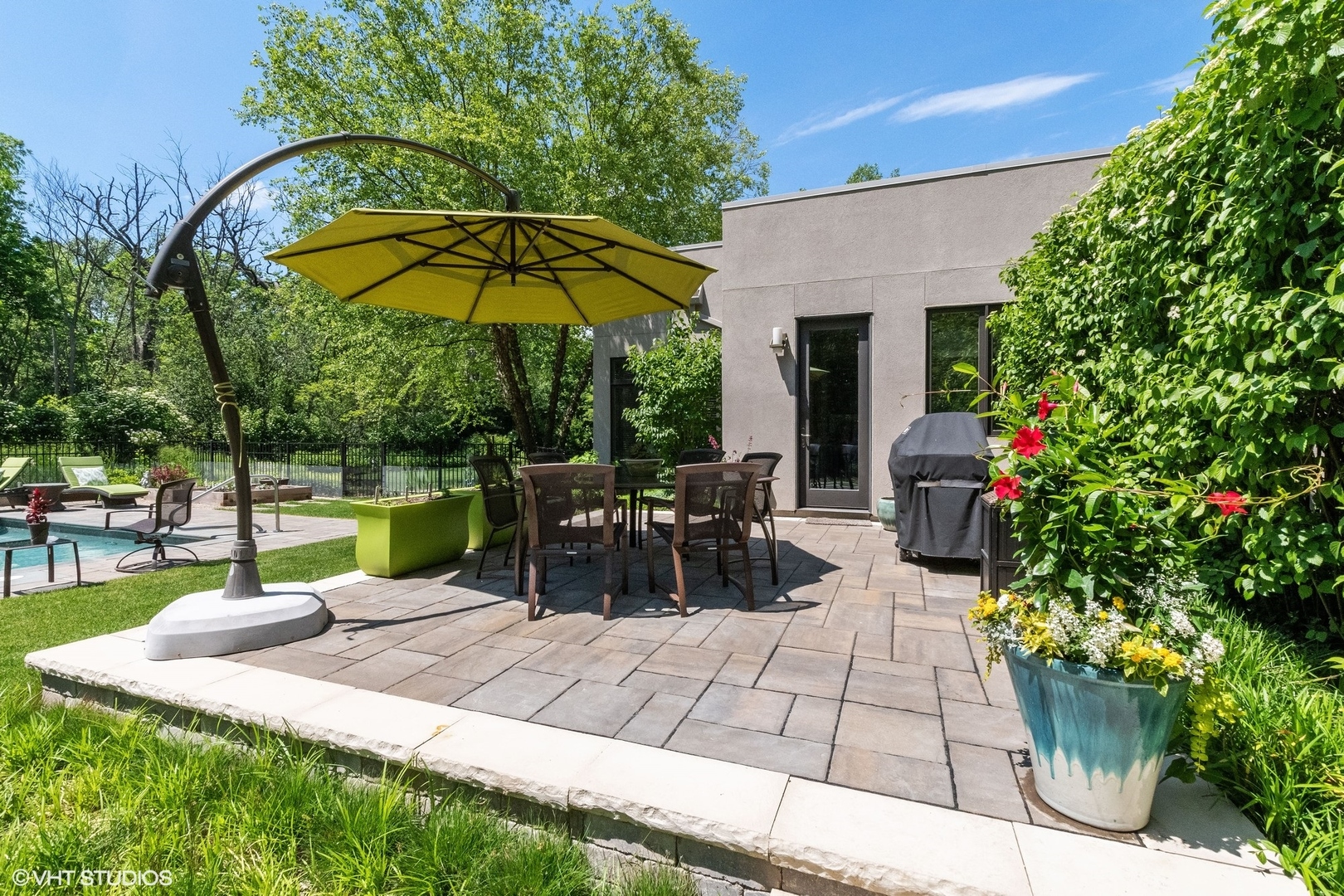 1632 Saunders Road Riverwoods, IL 60015 - Photo 4 of 38 a view of a backyard with sitting area and garden