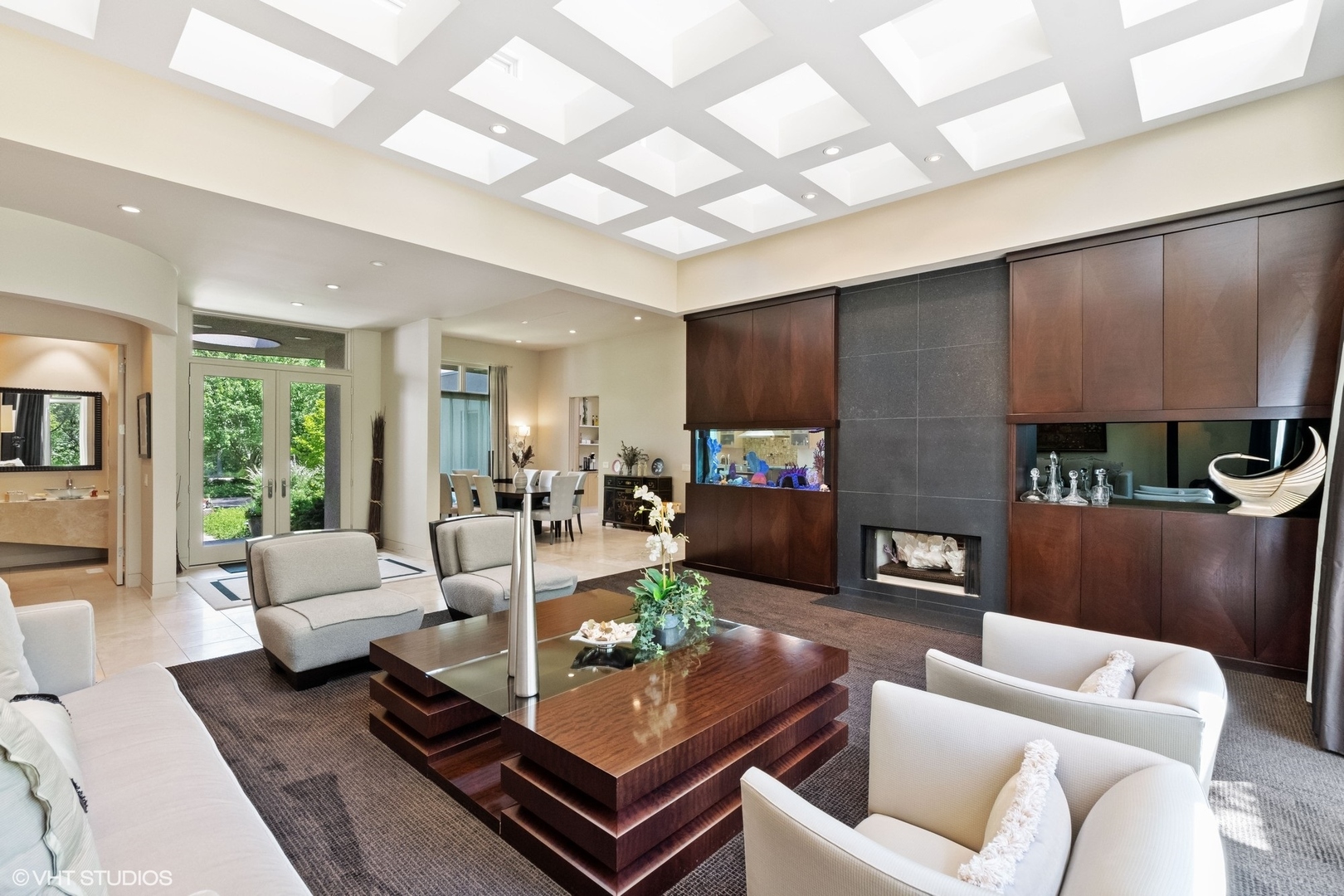 1632 Saunders Road Riverwoods, IL 60015 - Photo 8 of 38 a living room with furniture and a fireplace