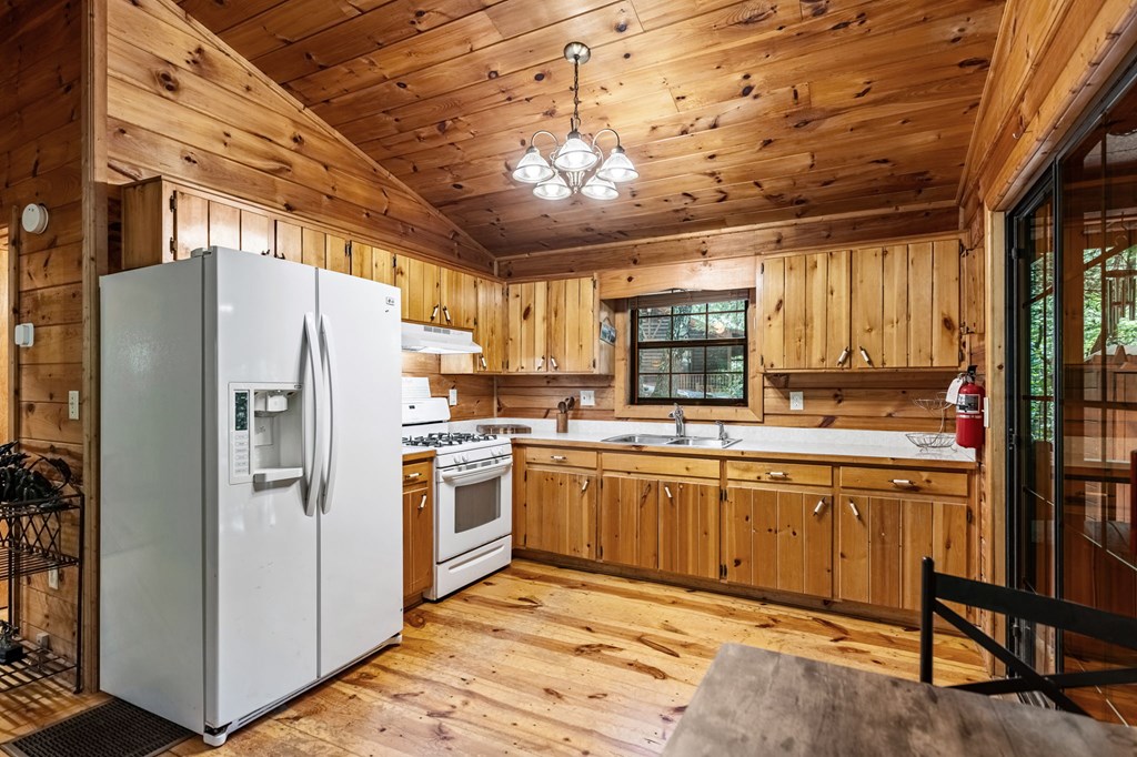120 Tomahawk Blue Ridge Blue Ridge, GA 30513 - Photo 28 of 56 a kitchen with stainless steel appliances granite countertop a refrigerator and a stove top oven