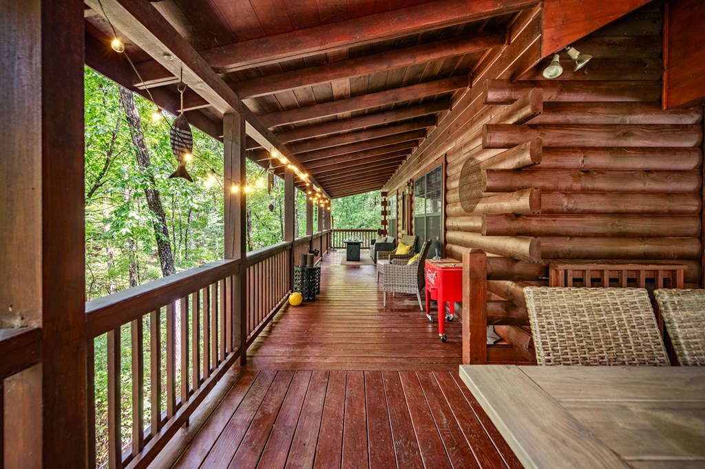 120 Tomahawk Blue Ridge Blue Ridge, GA 30513 - Photo 6 of 56 a view of a porch with wooden floor