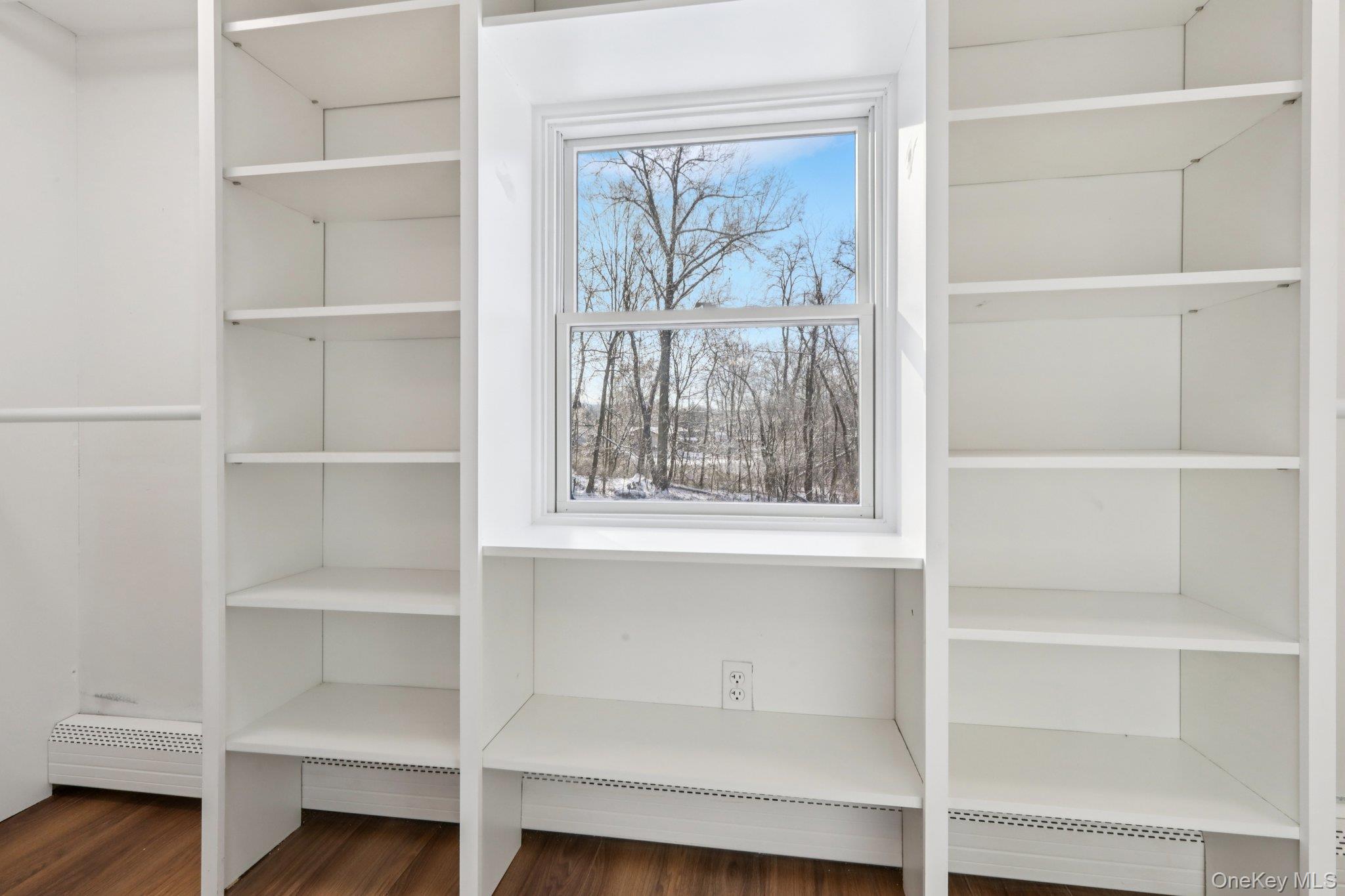 95 Smithtown Road Fishkill, NY 12524 - Photo 33 of 50 Spacious walk in closet featuring a baseboard radiator and waterproof laminate floors