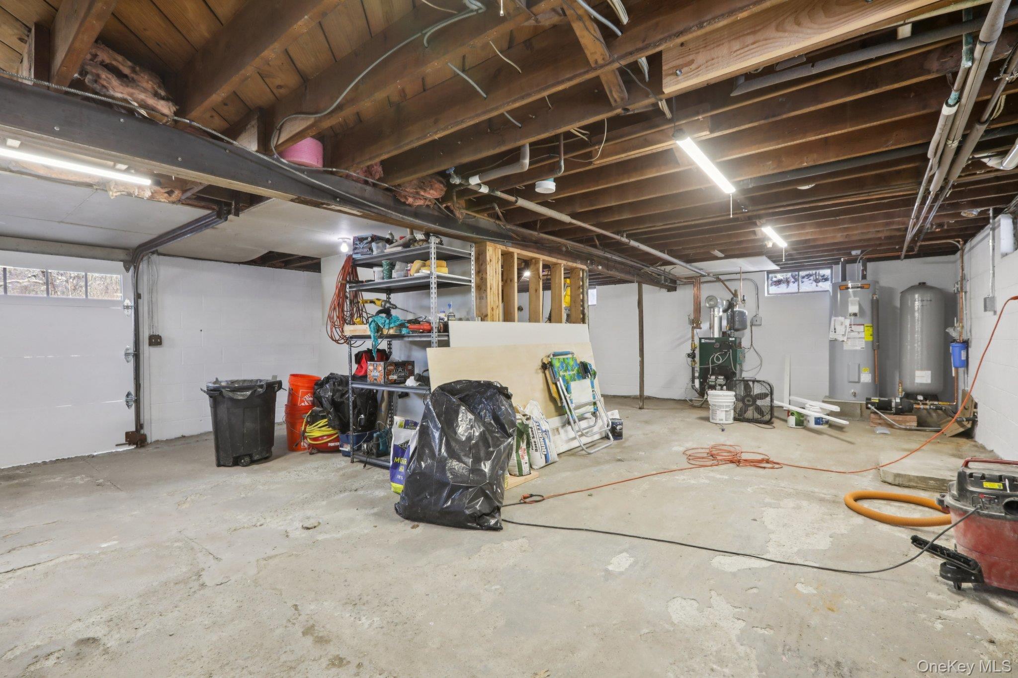 95 Smithtown Road Fishkill, NY 12524 - Photo 36 of 50 Basement with plenty of natural light, water heater, and a water pressure tank