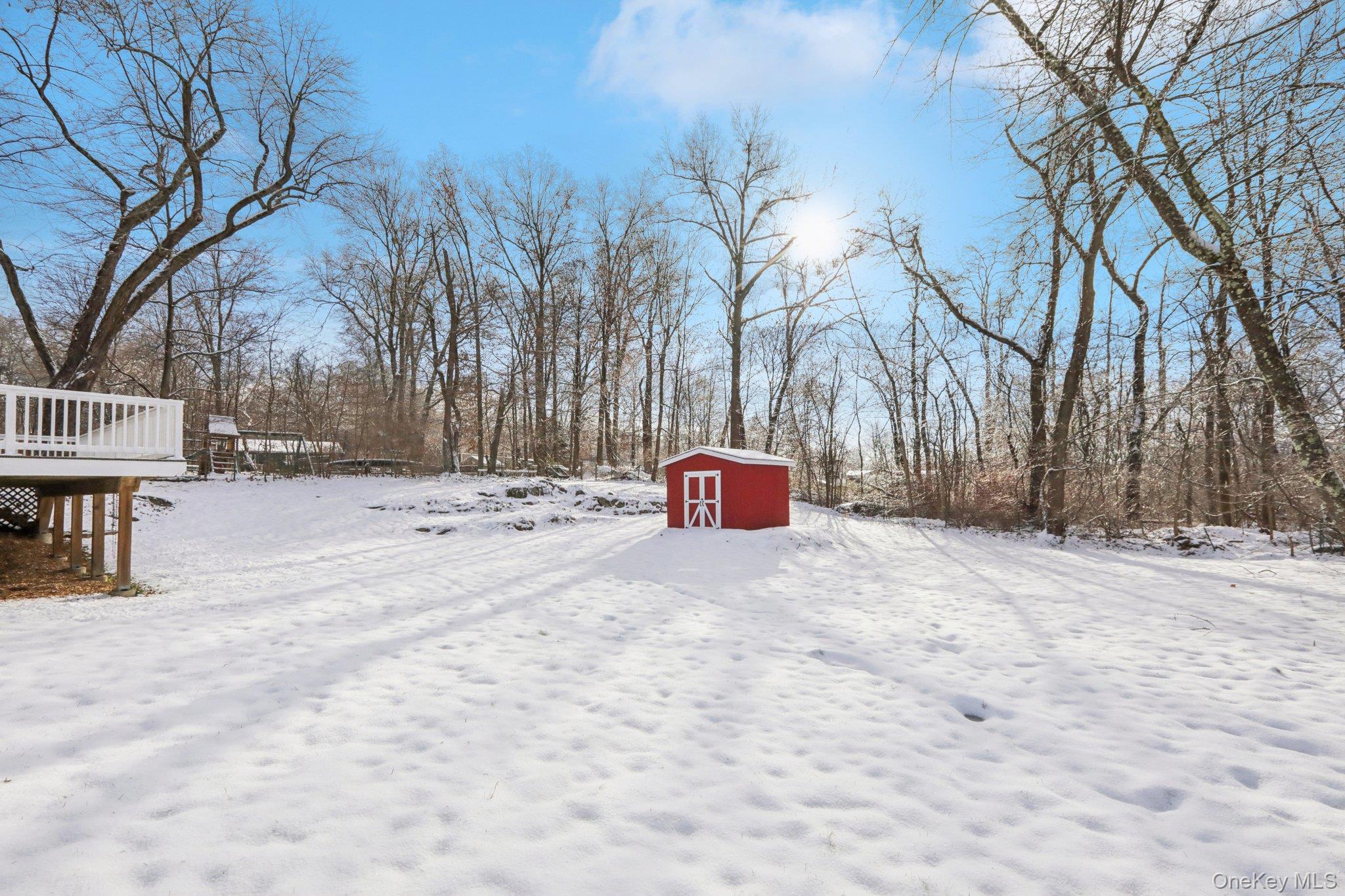 95 Smithtown Road Fishkill, NY 12524 - Photo 38 of 50 .50 acres of backyard covered in snow with a wooden deck and a shed