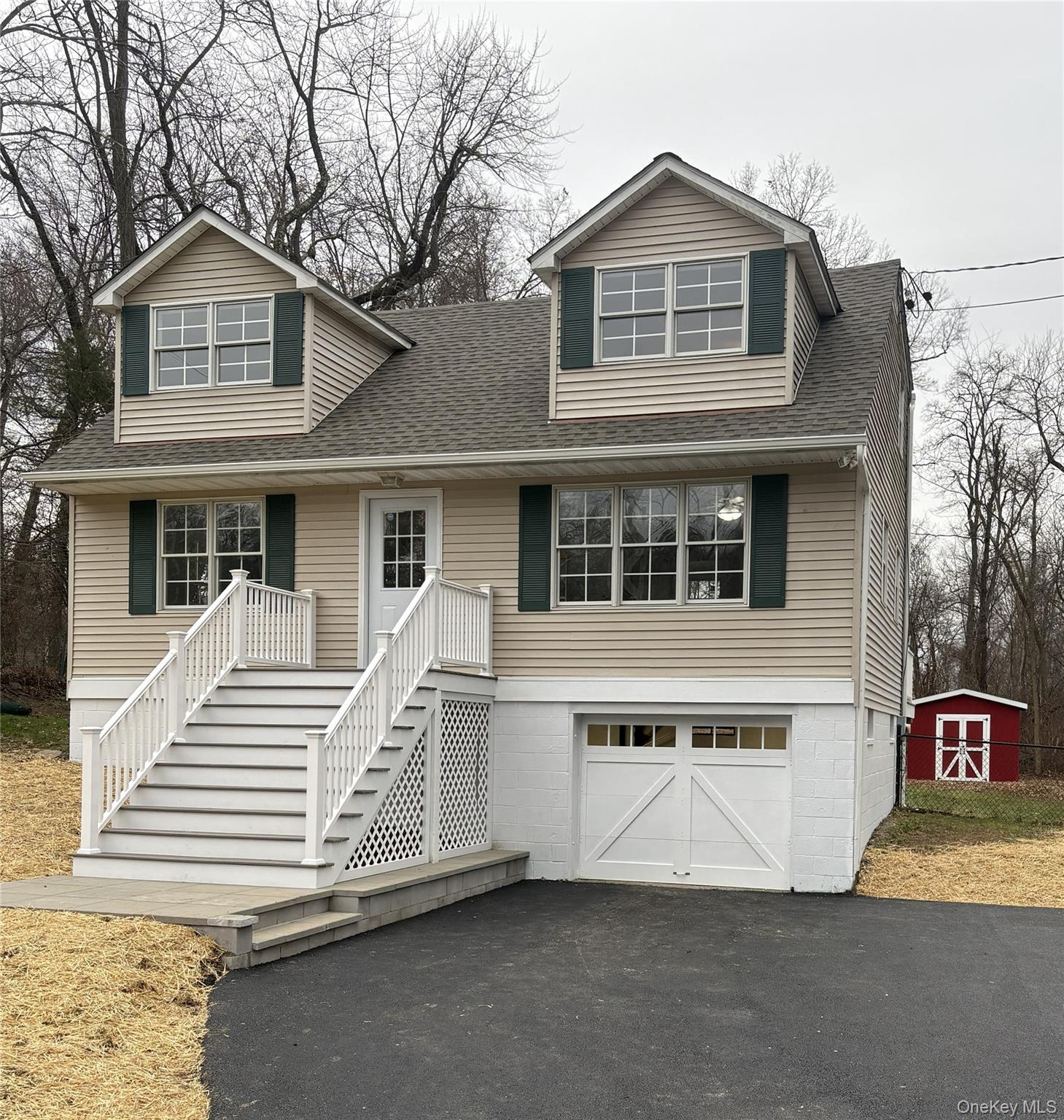 95 Smithtown Road Fishkill, NY 12524 - Photo 44 of 50 View of front facade featuring a new shingled roof, new asphalt driveway, and an attached garage