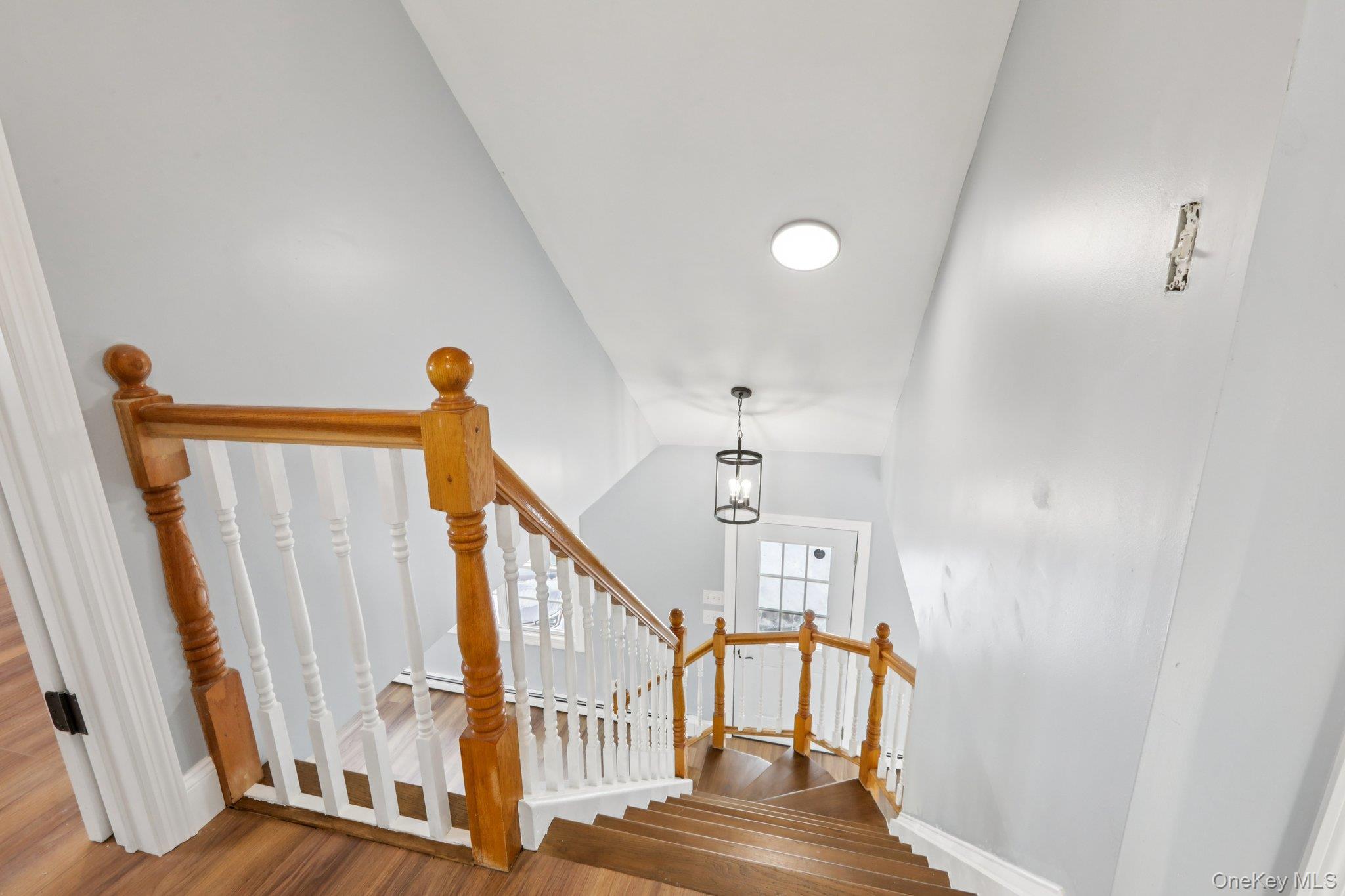 95 Smithtown Road Fishkill, NY 12524 - Photo 6 of 50 Stairs with wood finished floors and a chandelier