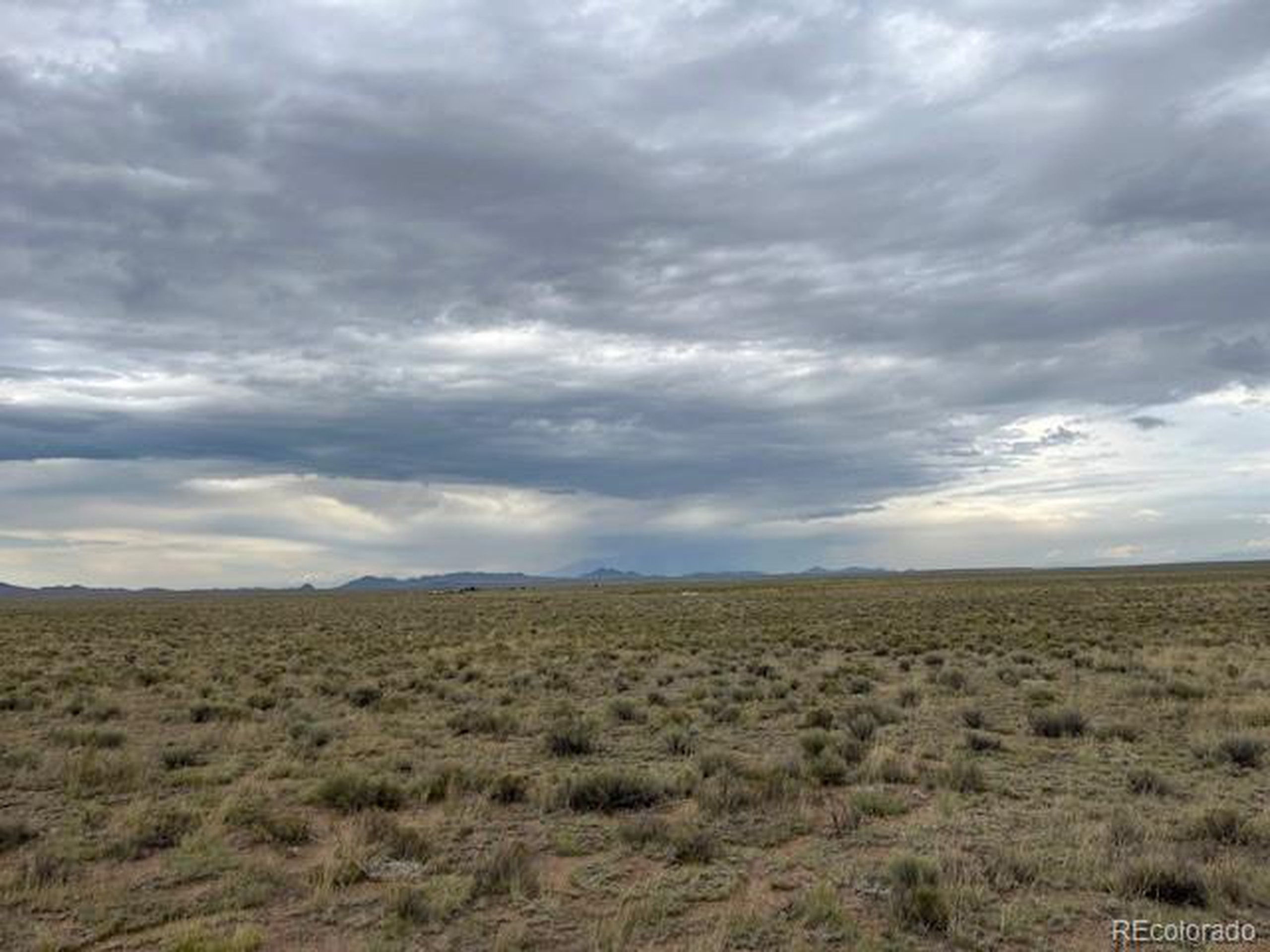 34 Co Road San Luis, CO 81152 - Photo 7 of 10 a view of a field of building in back