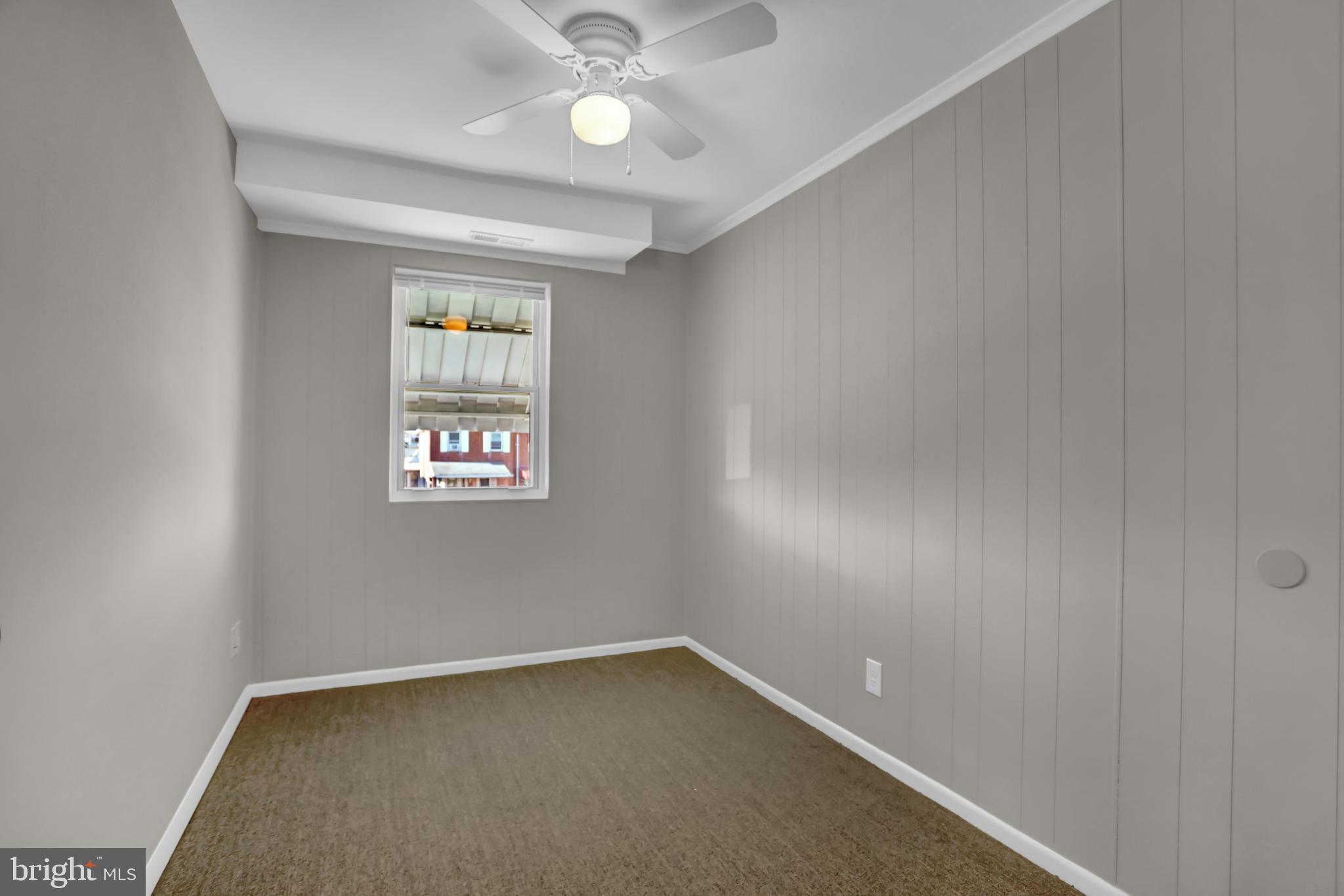 2857 Plainfield Road Baltimore, MD 21222 - Photo 13 of 38 an empty room with a window