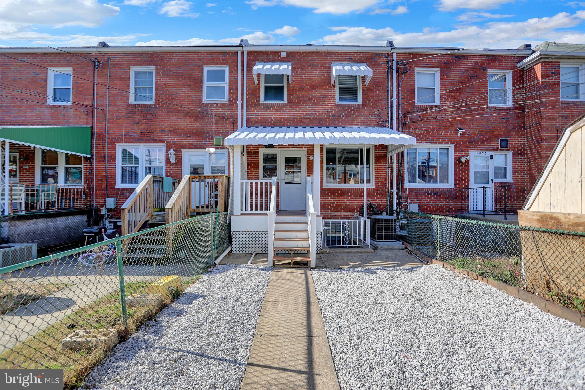 2857 Plainfield Road Baltimore, MD 21222 - Photo 27 of 38 a front view of a house with a garden