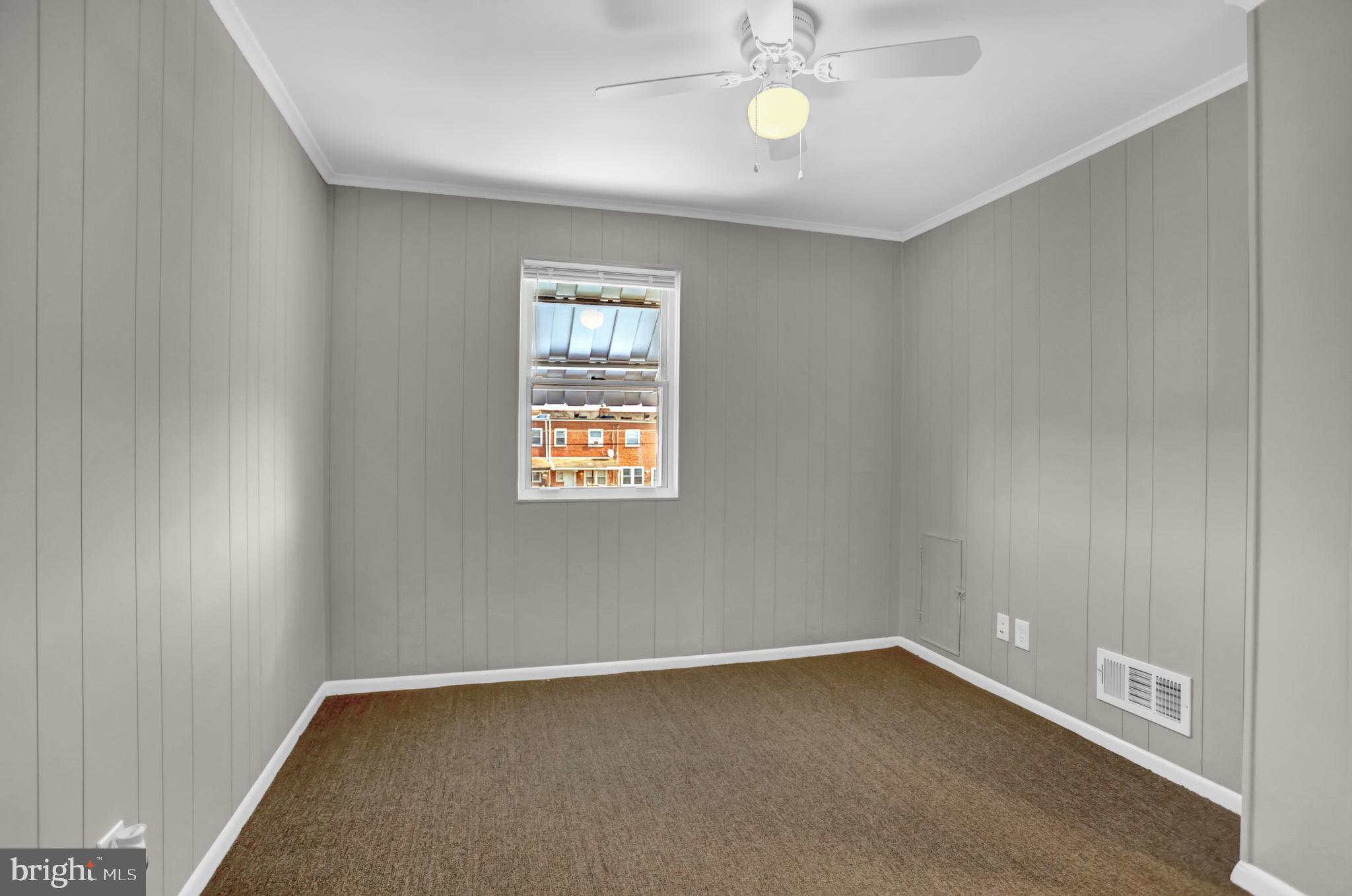 2857 Plainfield Road Baltimore, MD 21222 - Photo 8 of 38 a view of an empty room with a window