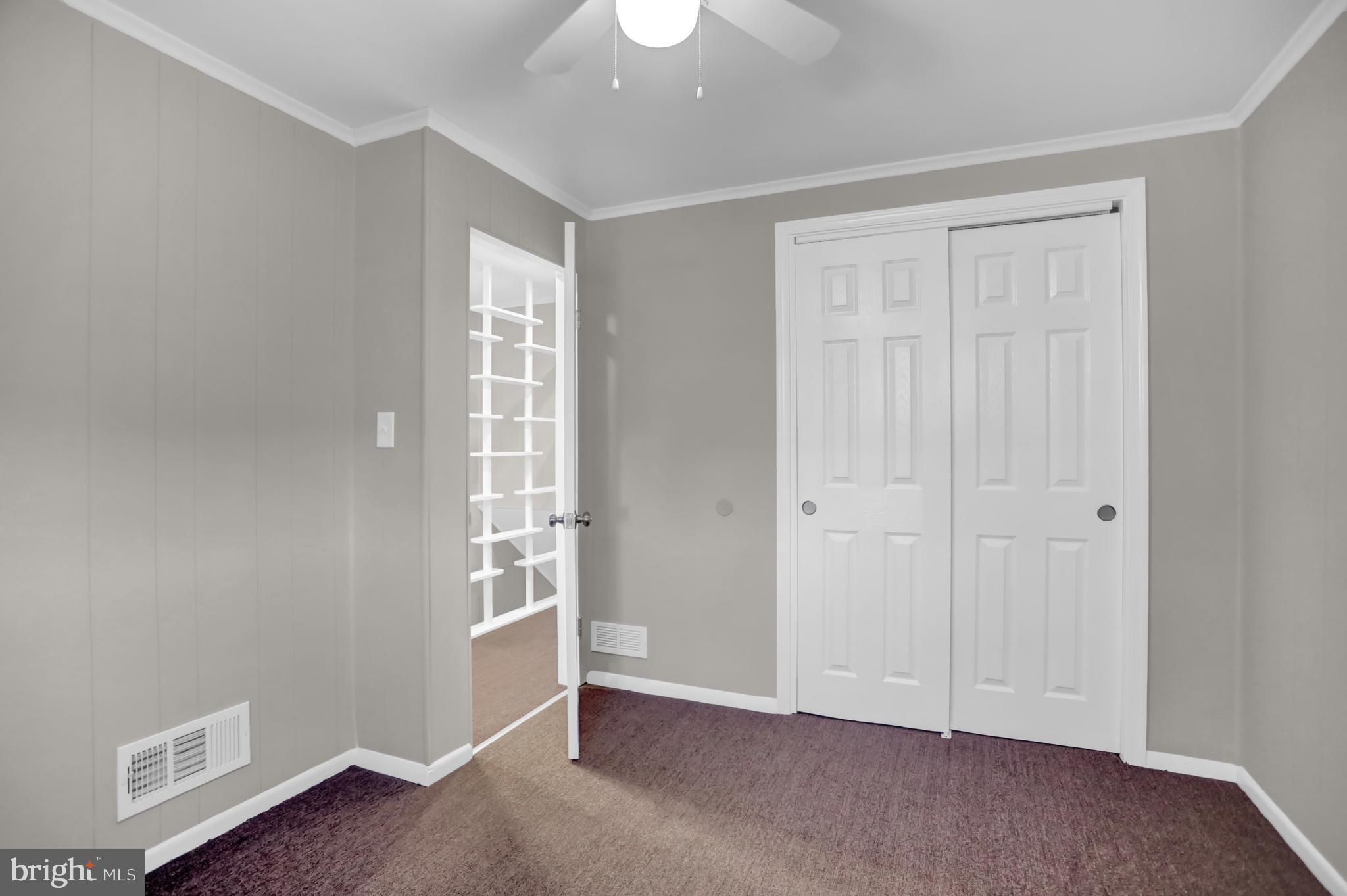 2857 Plainfield Road Baltimore, MD 21222 - Photo 10 of 38 an empty room with windows