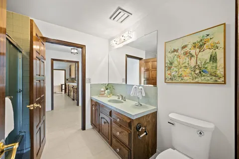 a bathroom with a sink a vanity and a mirror