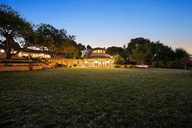 a view of a field with ocean view