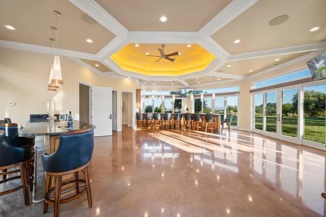 a lobby with furniture and a floor to ceiling window