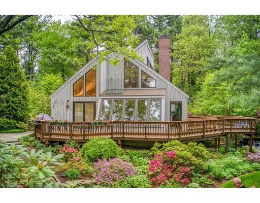 220 Old Littleton Road Harvard, MA 01451 - Photo 1 of 42 a front view of a house with a garden