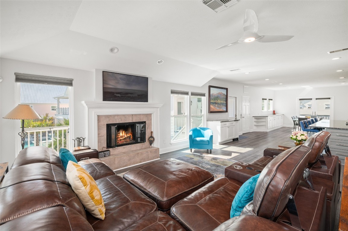 242 Isles End Road Tiki Island, TX 77554 - Photo 11 of 50 This angle of the main living floor emphasizes the flow and cheerful spaces.