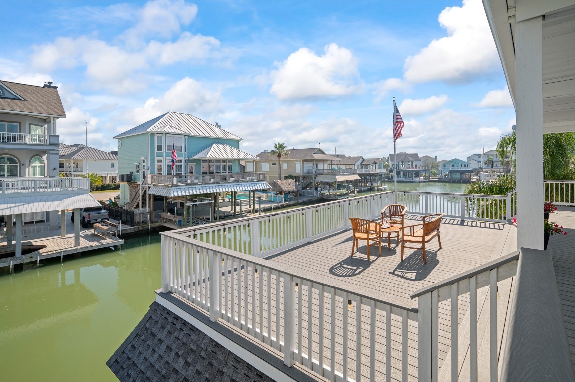 242 Isles End Road Tiki Island, TX 77554 - Photo 13 of 50 This lovely deck atop the boathouse provides the perfect space for lounging, sunning, or enjoying sunset cocktails while overlooking the canal and Jones Bay.