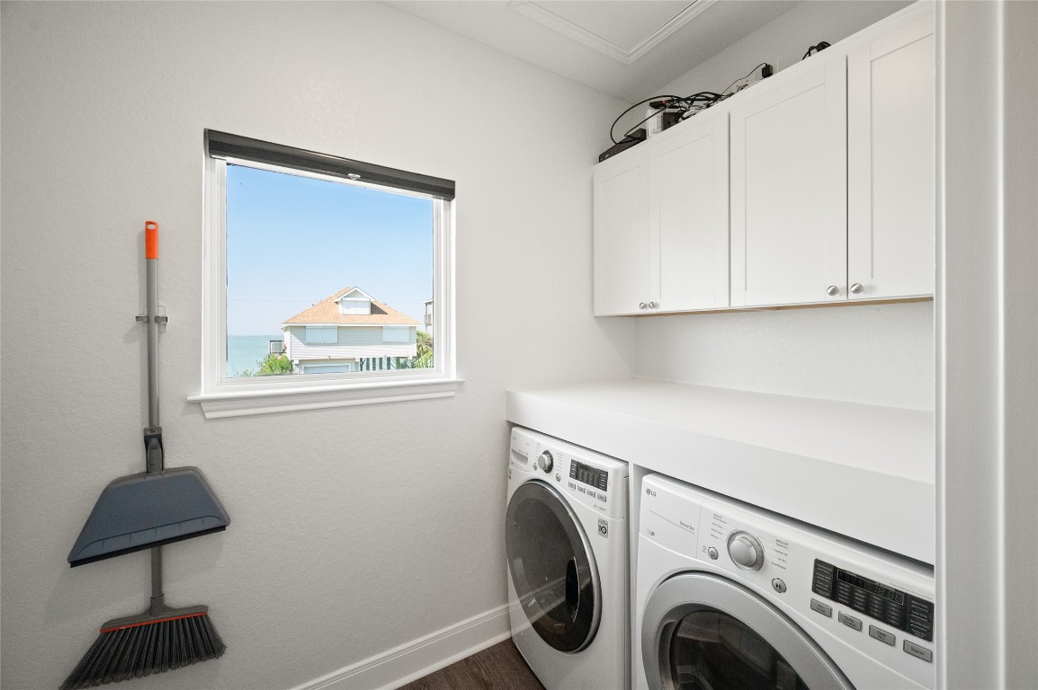 242 Isles End Road Tiki Island, TX 77554 - Photo 17 of 50 This oversized laundry room with extra storage sits next to the hall bath and overlooks Jones Bay.