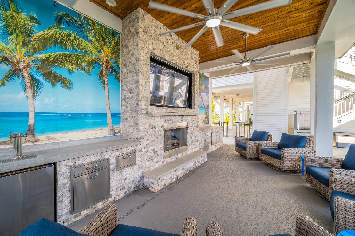 242 Isles End Road Tiki Island, TX 77554 - Photo 37 of 50 This charming outdoor space is enhance with exposed brick work and breadboard above.