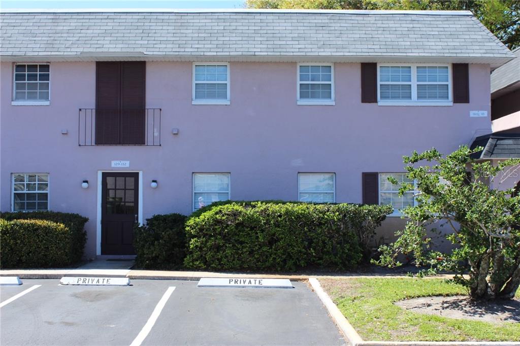 525 South Conway Road, Unit 130 Orlando, FL 32807 - Photo 1 of 1 a view of a house with a yard