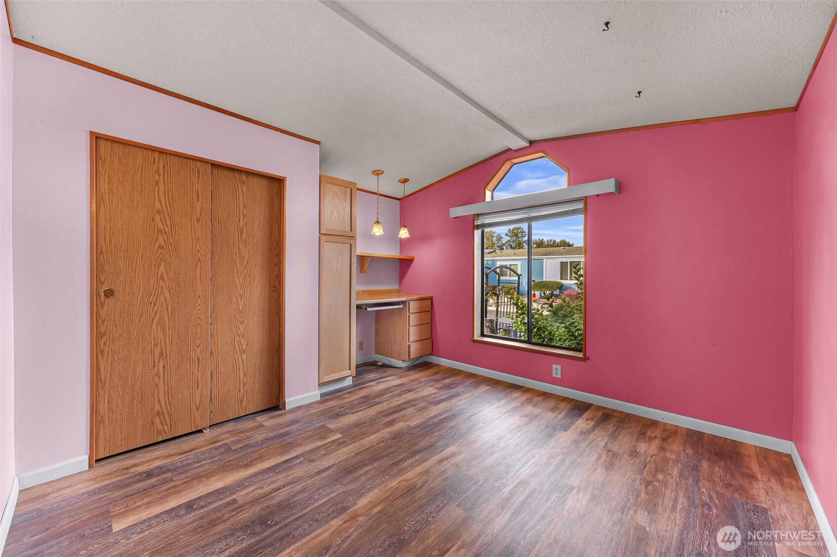 3802 James Street, Unit 23 Bellingham, WA 98226 - Photo 19 of 34 a view of an empty room with a window and wooden floor