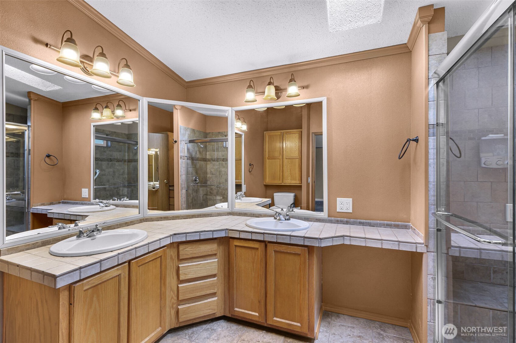 3802 James Street, Unit 23 Bellingham, WA 98226 - Photo 24 of 34 a bathroom with a granite countertop sink and a mirror