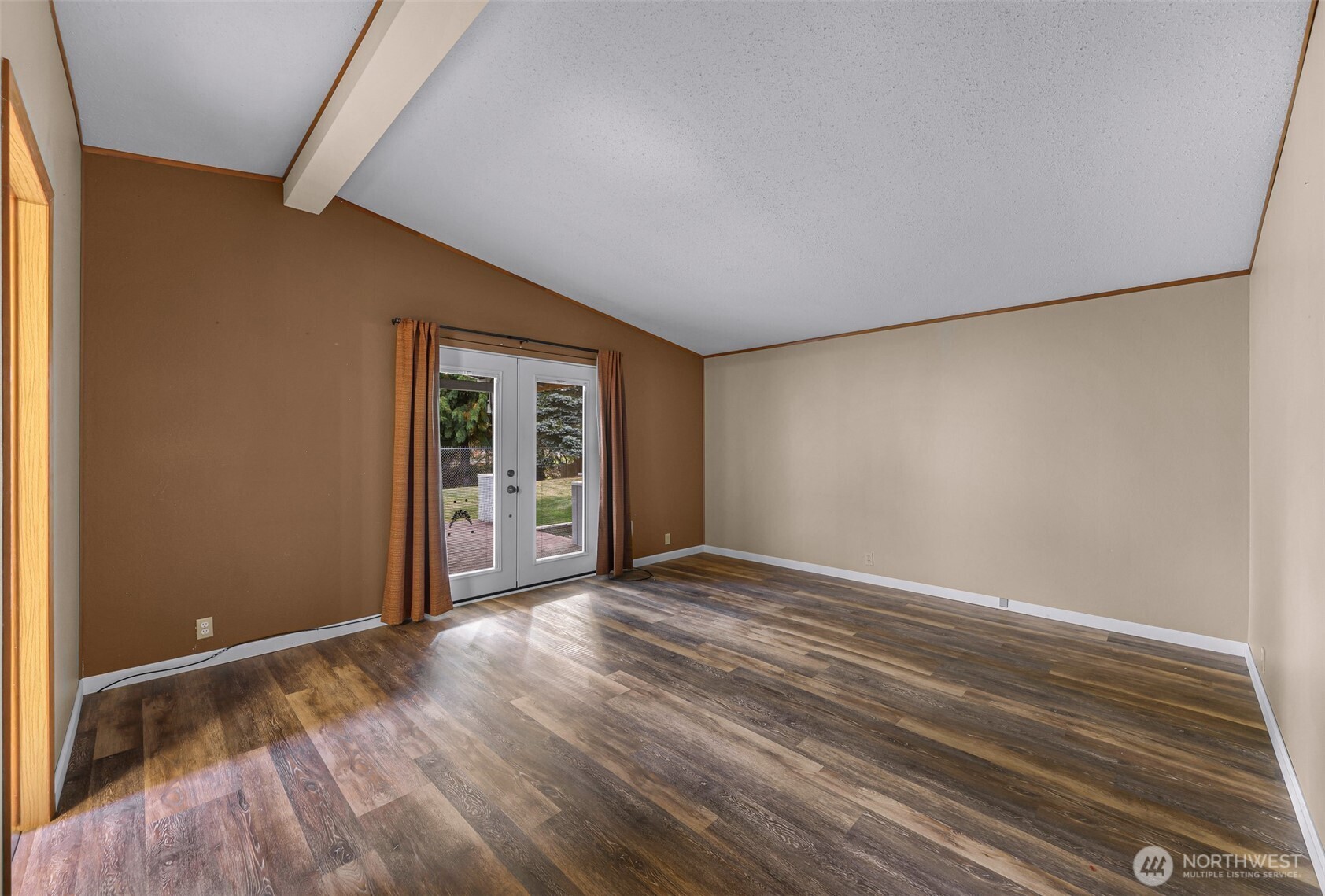 3802 James Street, Unit 23 Bellingham, WA 98226 - Photo 25 of 34 a view of an empty room with wooden floor and a window