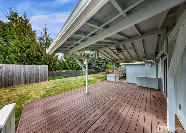 a view of porch with wooden floor