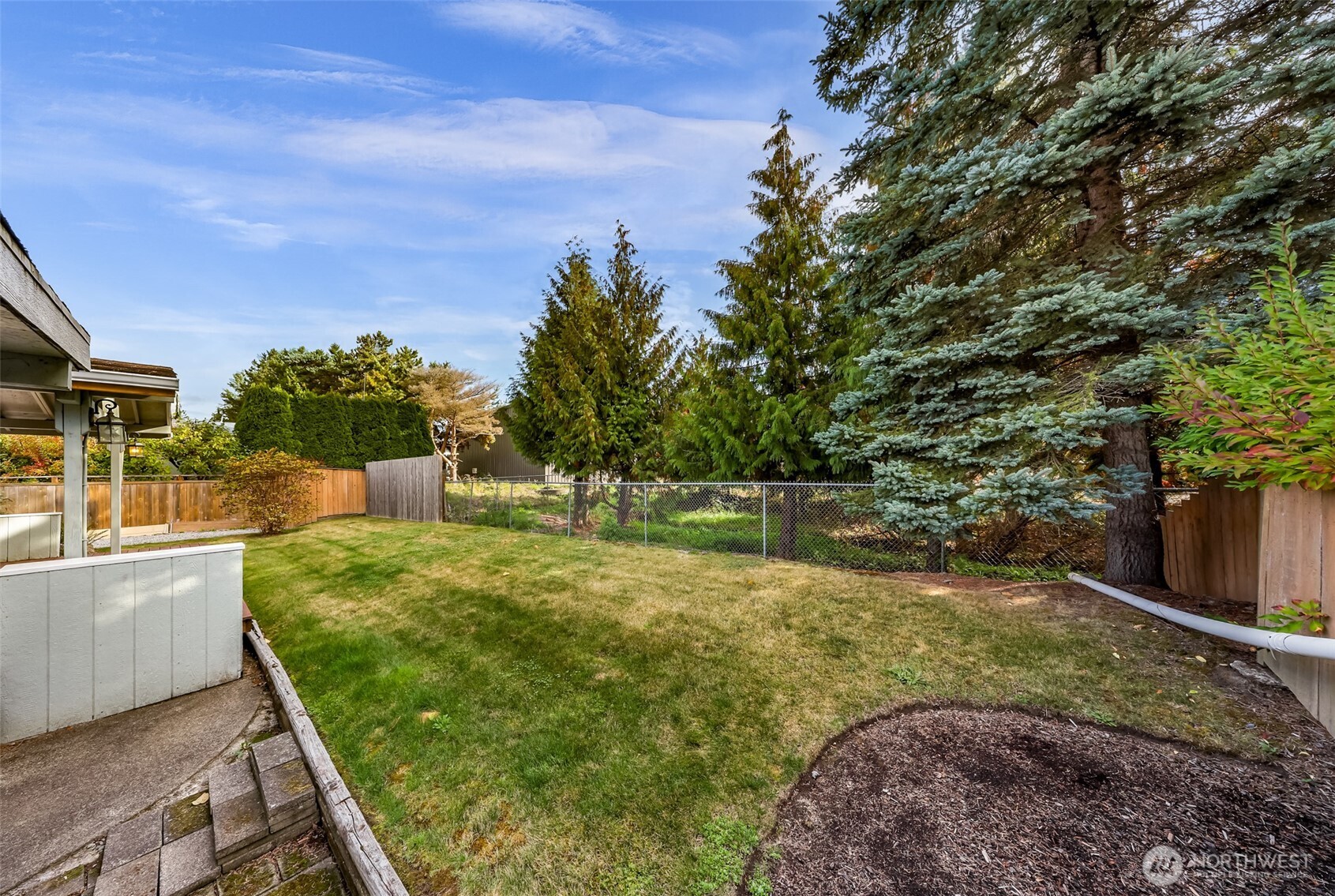 3802 James Street, Unit 23 Bellingham, WA 98226 - Photo 29 of 34 a view of a backyard with large trees