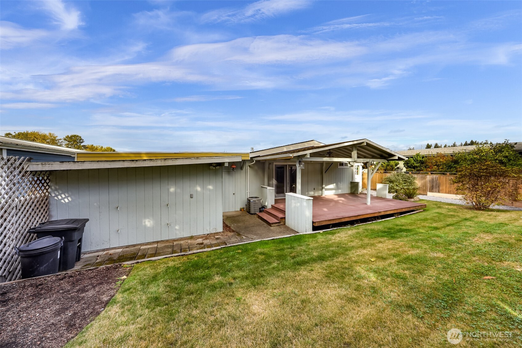 3802 James Street, Unit 23 Bellingham, WA 98226 - Photo 34 of 34 a backyard of a house with table and chairs
