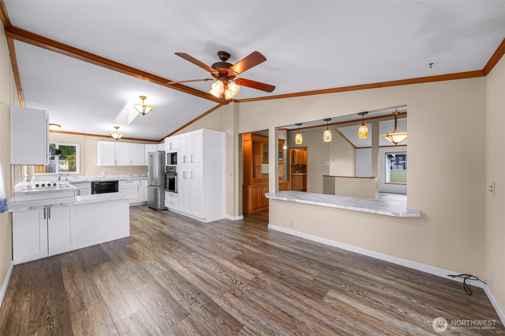 3802 James Street, Unit 23 Bellingham, WA 98226 - Photo 4 of 34 a view of a living room and kitchen with wooden floor
